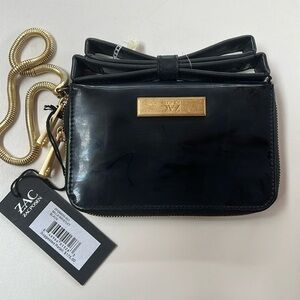 zac posen patent leather bow clutch. NWT but patent is a little faded